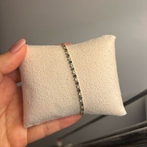 Avon tennis bracelet with blue and white stones